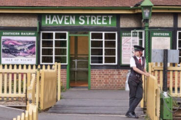 Havenstreet Railway Station with young volunteer -