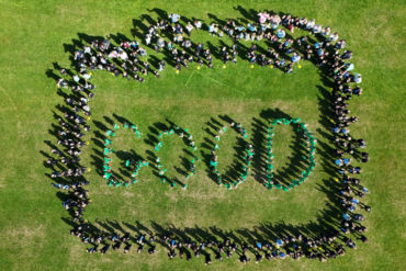 Aerial shot of pupils on the playing field spelling out Good