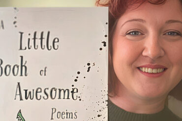 Lottie Begg with her poetry book