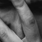 Man holding his head in his hands