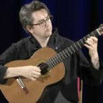 Manus Noble playing the guitar
