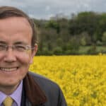 Martin Tod, LibDem candidate for Mayor standing in a field of yellow rapeseed crops