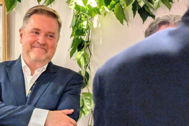 Nigel smiling at his retirement party