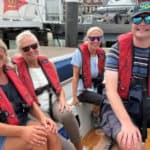 People on a boat with Cowes Sailability
