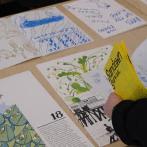 Person looking at poster for card 18