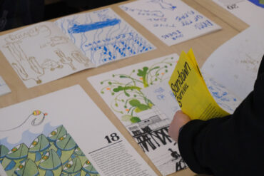 Person looking at poster for card 18