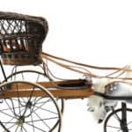Queen Victoria's pushchair - a wicker seat for the child to be placed in and a pair of dappled grey horses at the front, that gallop up and down when pushed