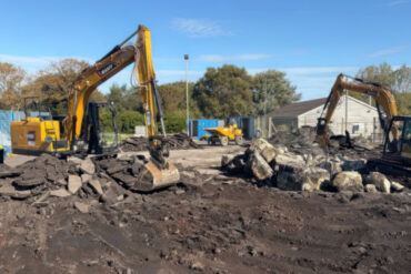 Diggers on the site of Sandham Gardens pulling up the earth to create the new playzone