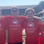 Four men dressed in St Catherine's School T-shirts getting read to take part in the sky dive