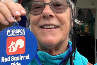 cyclist with medal for completing 35 mile cycle ride