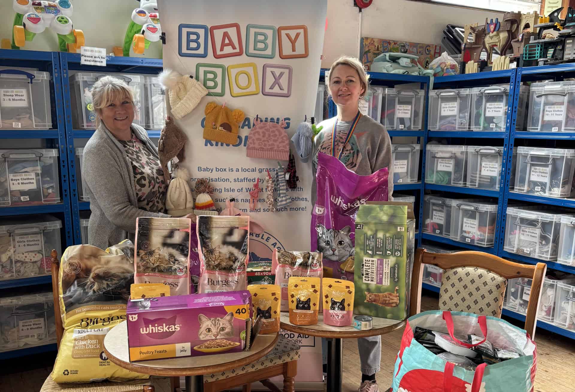Women at Baby Box with pet food donations