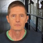Michael Smith standing in jail corridor