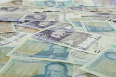 lots of five pound and twenty pound notes sterling cash money