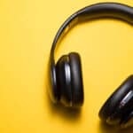 wireless headphones on a yellow background