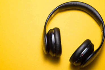 wireless headphones on a yellow background