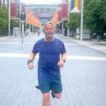 Peter Higgin running up the road to Wembley Stadium