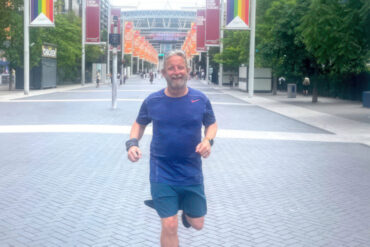 Peter Higgin running up the road to Wembley Stadium