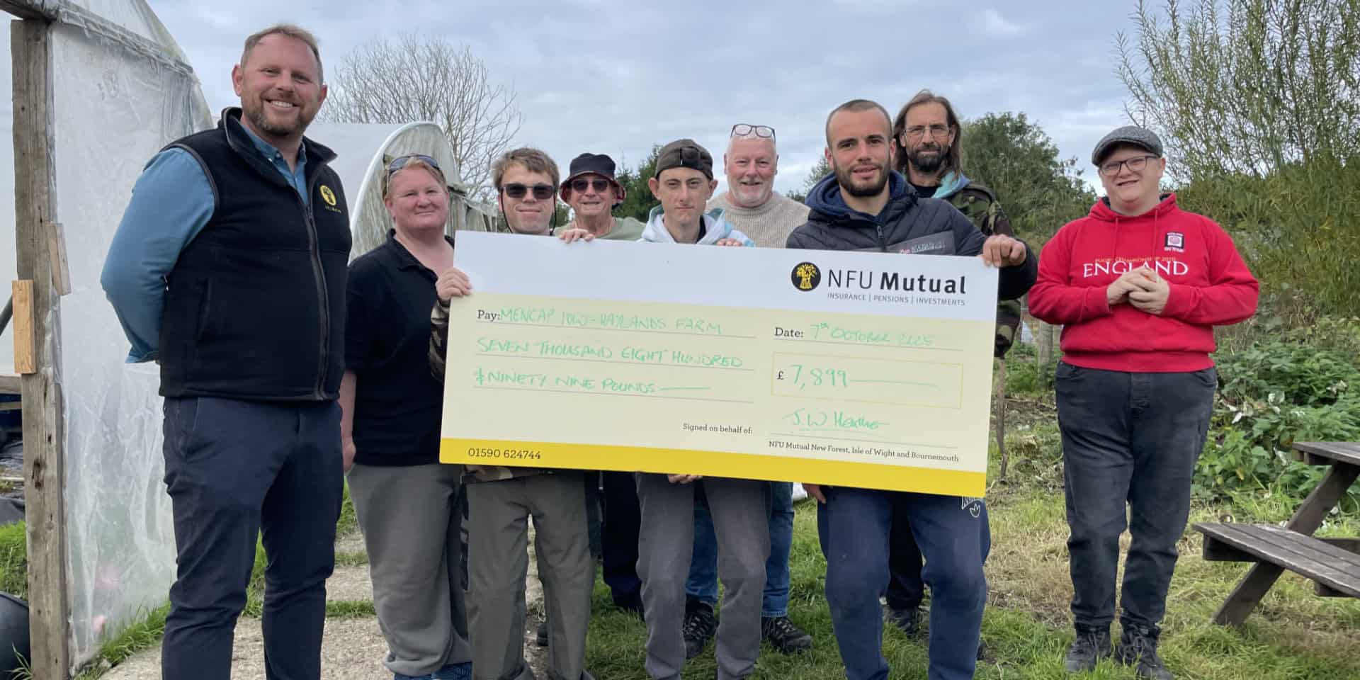 John Heather Senior Agent at NFU Mutual New Forest, Isle of Wight and Bournemouth (far left), with Nichola Cook, Manager at Haylands Farm (second from left) and volunteers at the Farm