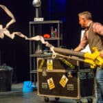 Mark Thompson on stage with all his scientific equipment