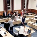 Screen grab of councillor gladwin being comforted out of the chamber