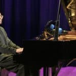 Amiri Harewood at the gran piano