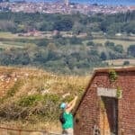Person photographing part of Bembridge Fort, with the Solent and Mainland in the distance