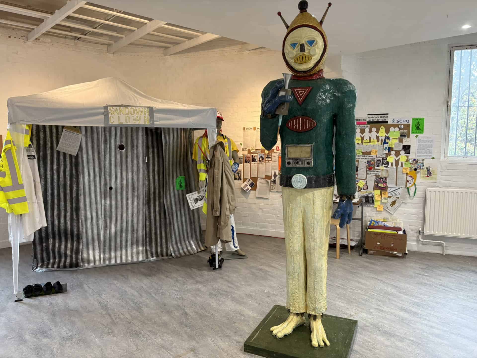 Sam the 8-ft Sandown Clown Statue in the middle of the gallery space