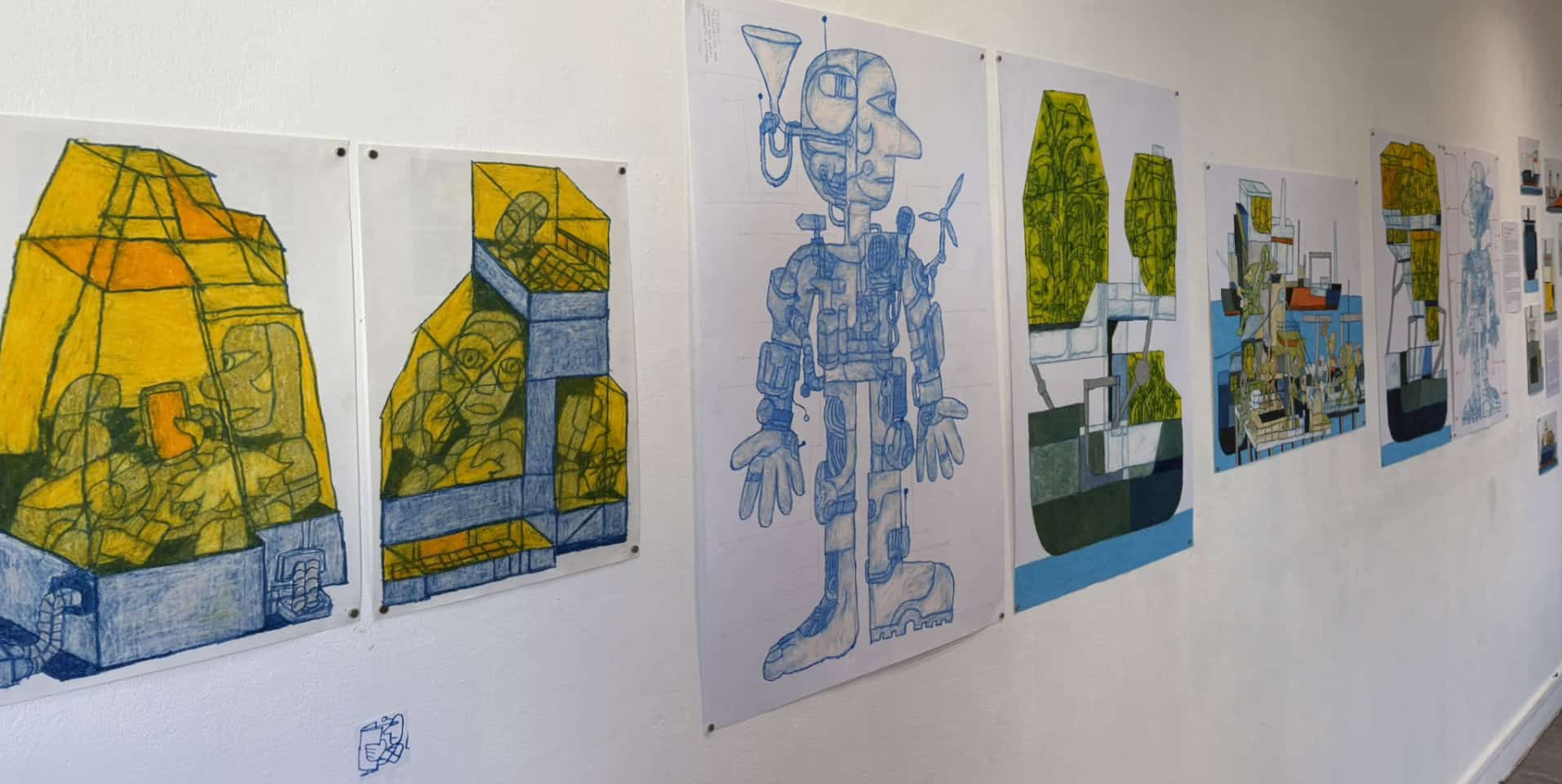 Tomy's pastel drawings on the gallery wall