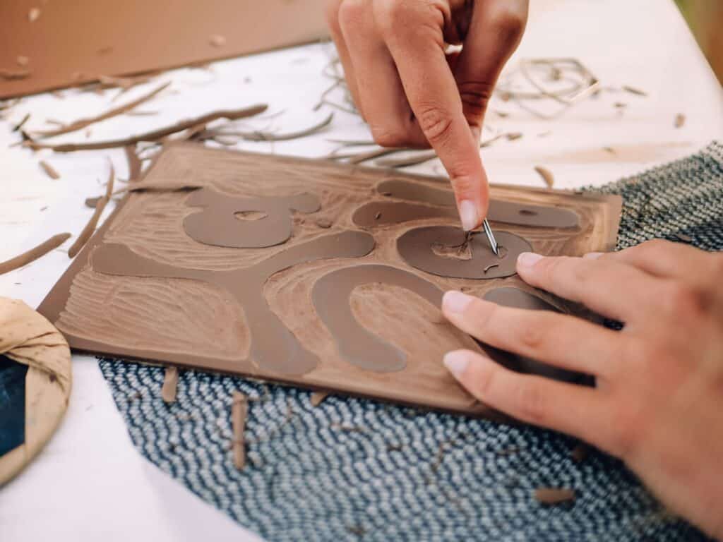 a person working on linocutting 