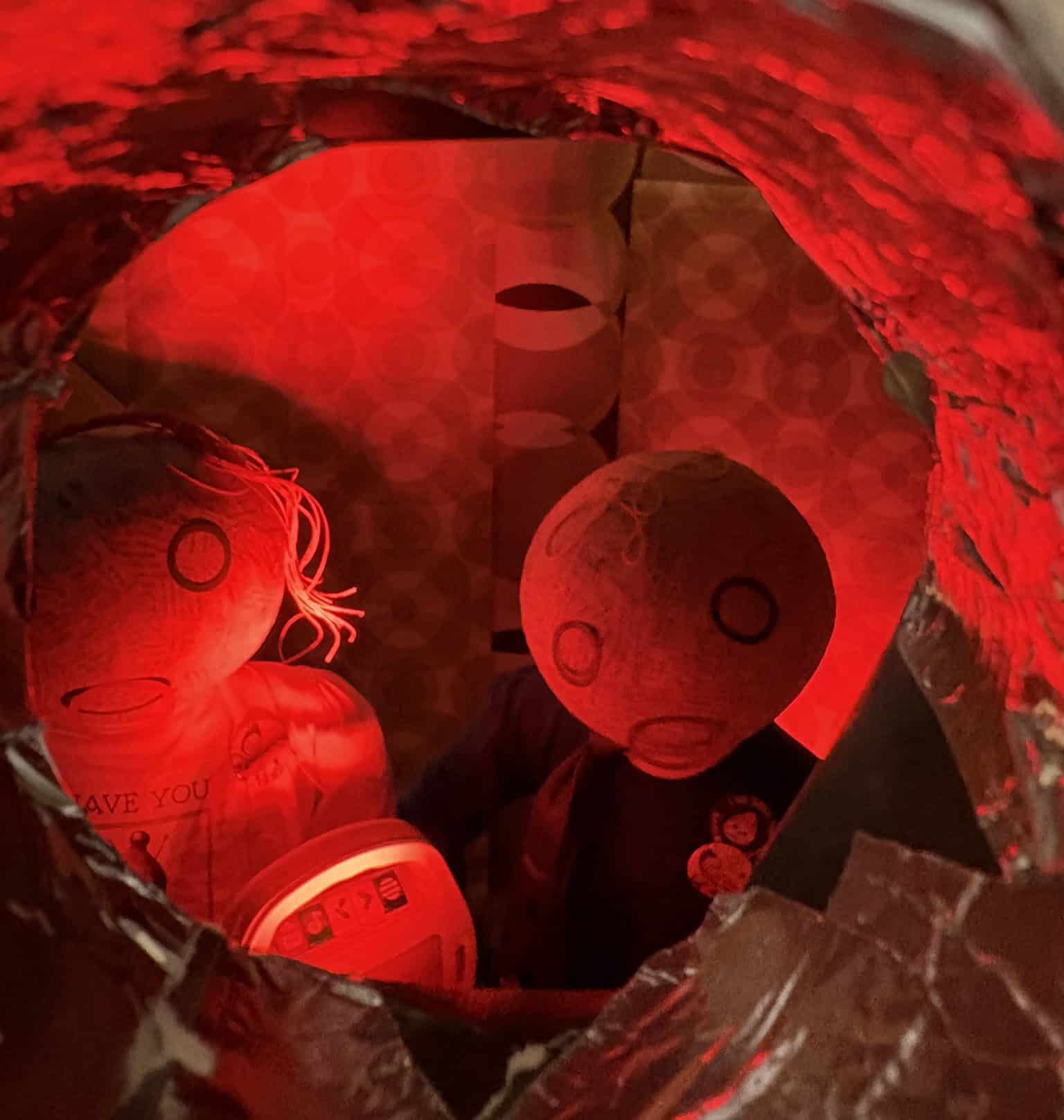 Looking through the peephole to see the two child mannequins