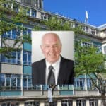 Portrait shot of John Howe with County Hall in the background