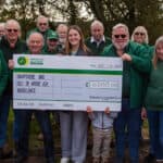 Members of the jaguar car club with giant cheque for Air Ambulance charity