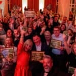 red funnel award winners holding up their awards in Northwood House - nov 2025