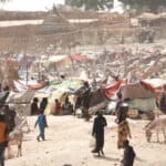 refugee camp with people who fled Sudan