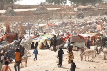 refugee camp with people who fled Sudan
