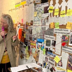 teresa grimaldi talking on the microphone at quay arts