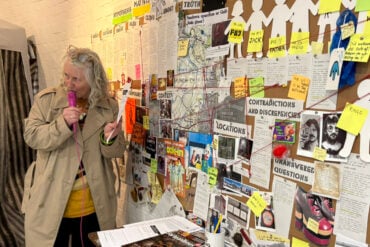 teresa grimaldi talking on the microphone at quay arts