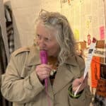 teresa grimaldi talking on the microphone at quay arts