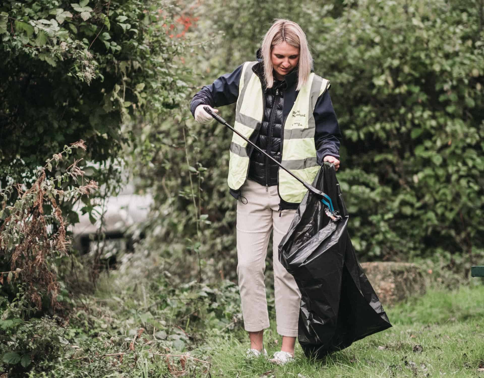 woman litter picking in the park