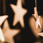 wooden stars handing from a tree