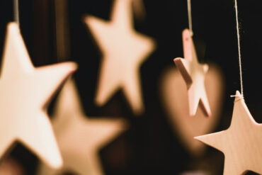 wooden stars handing from a tree