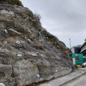 Work to Belgrave Road showing the metal netting on the rockface