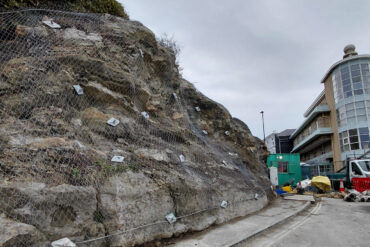 Work to Belgrave Road showing the metal netting on the rockface