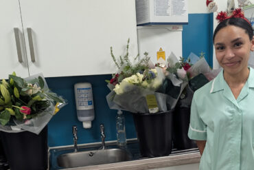 A&E nurse with donations of flowers