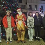 Young people on the walk in Newport with someone dressed as santa