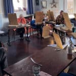 Person modelling for art class in the back of Better Days Cafe