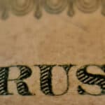 The words trust printed on sepia coloured paper