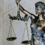 brass statue of lady justice