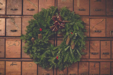 christmas wreath on a background of wooden drawers
