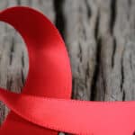 red ribbon on a tree truck